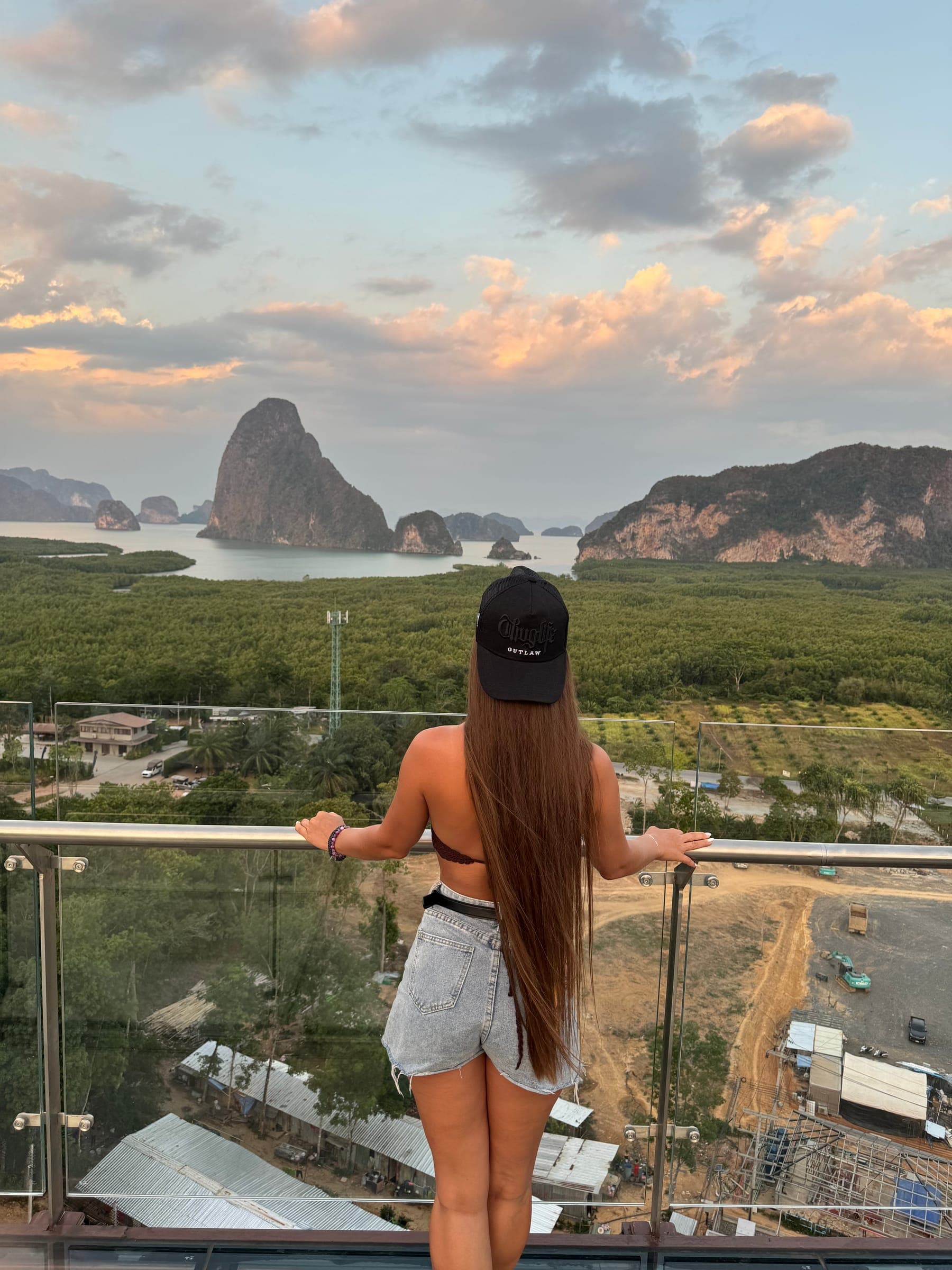 Sunset over limestone islands seen from a viewpoint
