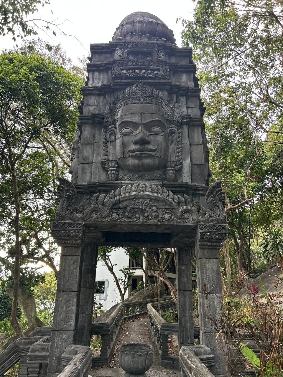 Temple gate with a carved stone face